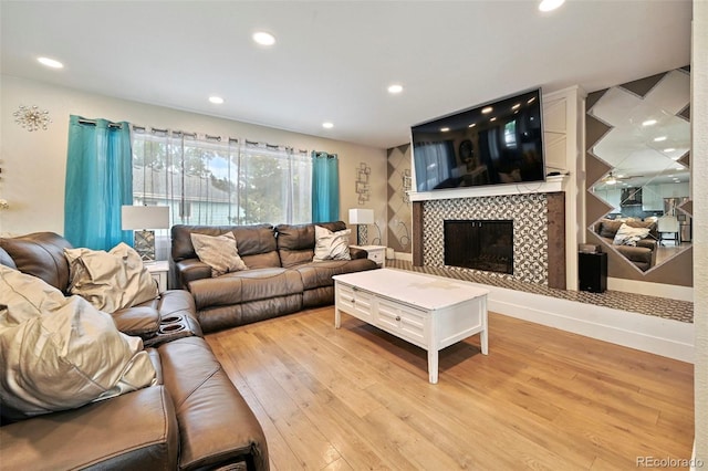 3340 Afternoon Cir, Colorado Springs, CO 80910 - living room with light wood finished floors, recessed lighting, and a tile fireplace