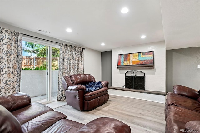 3340 Afternoon Cir, Colorado Springs, CO 80910 - living room with a fireplace, wood finished floors, and recessed lighting