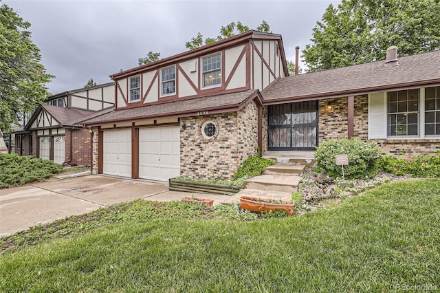 2556 S Eagle Cir, Aurora, CO 80014 - tudor house with brick siding, a front yard, driveway, a garage, and roof with shingles