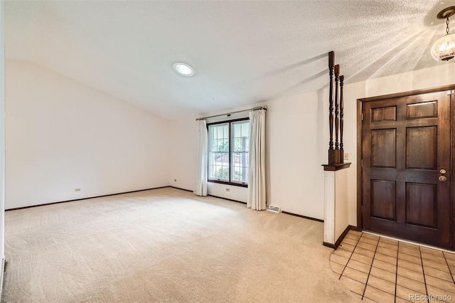 2556 S Eagle Cir, Aurora, CO 80014 - foyer featuring lofted ceiling, light carpet, and baseboards