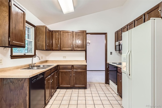 2556 S Eagle Cir, Aurora, CO 80014 - kitchen featuring white appliances, a sink, lofted ceiling, light countertops, and light tile patterned flooring