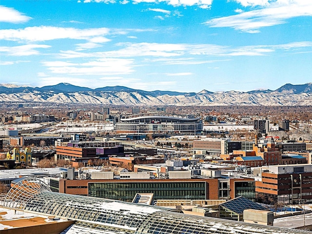 property's view of city with a mountain view