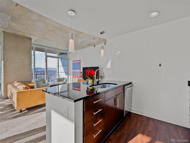 kitchen with pendant lighting, sink, dishwasher, dark hardwood / wood-style floors, and kitchen peninsula