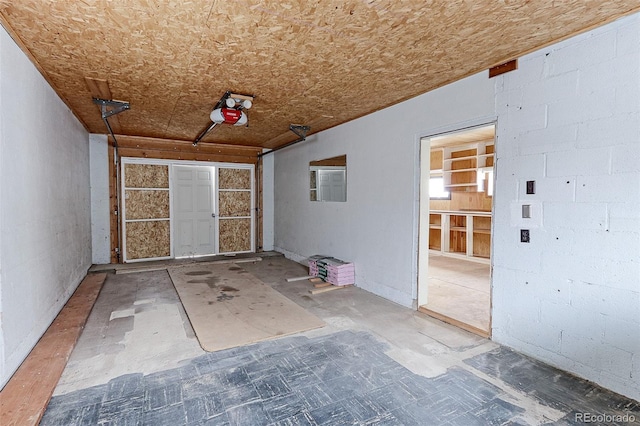 interior space with concrete block wall