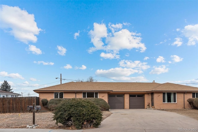 ranch-style home featuring a garage