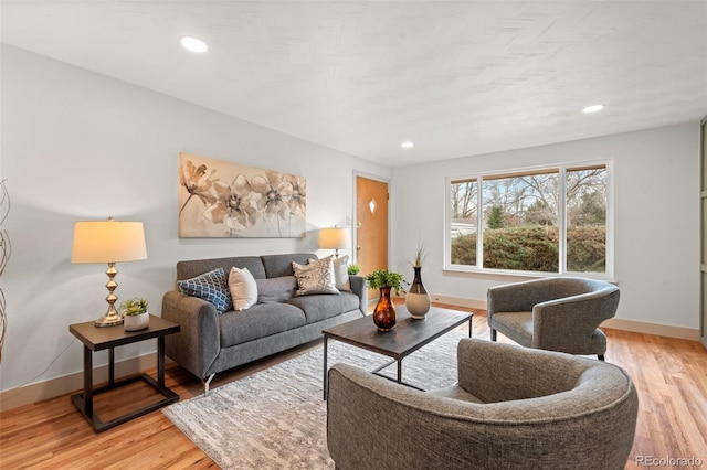 living room with recessed lighting, wood finished floors, and baseboards