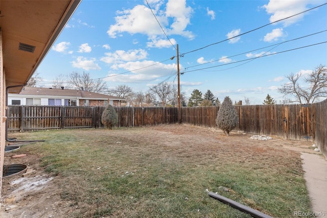 view of yard featuring a fenced backyard