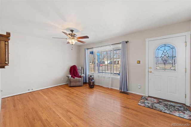 entrance foyer featuring light wood-type flooring and ceiling fan