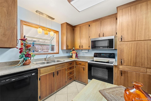 kitchen featuring dishwasher, sink, decorative light fixtures, light tile patterned flooring, and range with electric cooktop