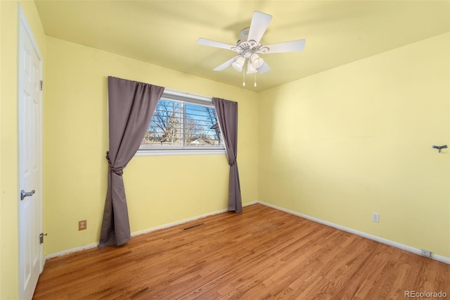 unfurnished room with light hardwood / wood-style floors and ceiling fan