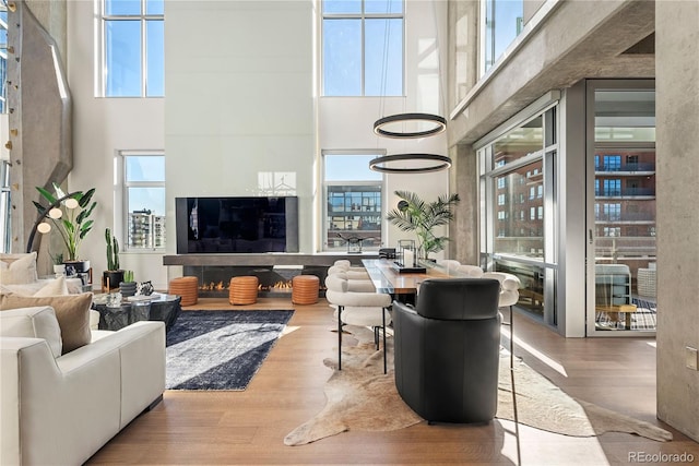1610 Little Raven St Unit Ph6, Denver, CO 80202 - living area with a high ceiling and wood finished floors