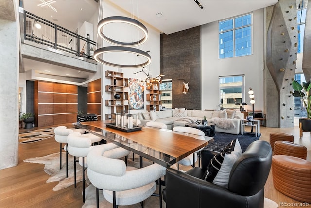 1610 Little Raven St Unit Ph6, Denver, CO 80202 - dining space with a high ceiling and wood finished floors