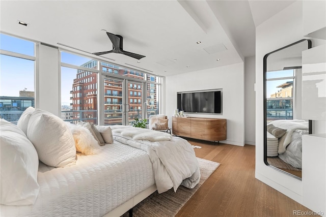 1610 Little Raven St Unit Ph6, Denver, CO 80202 - bedroom with wood finished floors and expansive windows