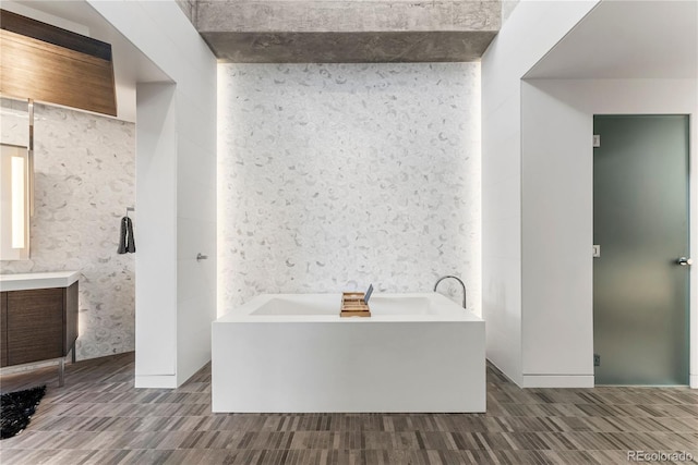 1610 Little Raven St Unit Ph6, Denver, CO 80202 - full bathroom with vanity, a bath, and wallpapered walls
