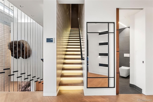 1610 Little Raven St Unit Ph6, Denver, CO 80202 - staircase with wood finished floors and baseboards