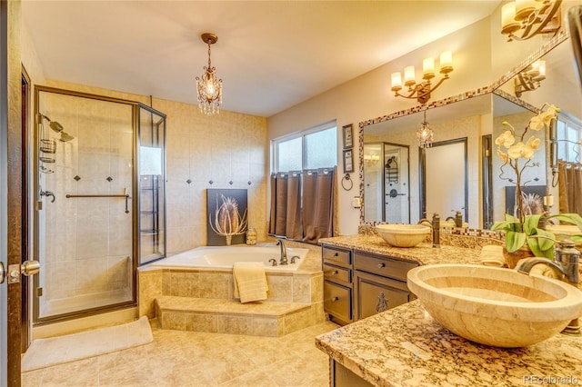 14915 Gleneagle Dr, Colorado Springs, CO 80921 - bathroom featuring vanity, a bath, a shower stall, and a chandelier