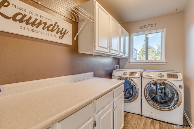 14915 Gleneagle Dr, Colorado Springs, CO 80921 - laundry area with cabinet space, washer and dryer, and light wood-style flooring