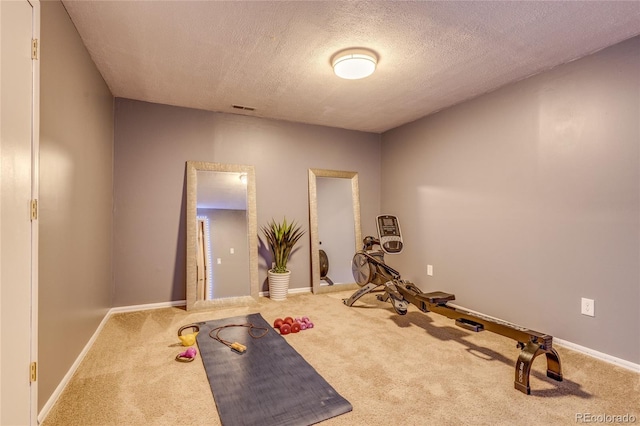 14915 Gleneagle Dr, Colorado Springs, CO 80921 - exercise room with carpet floors, a textured ceiling, and baseboards