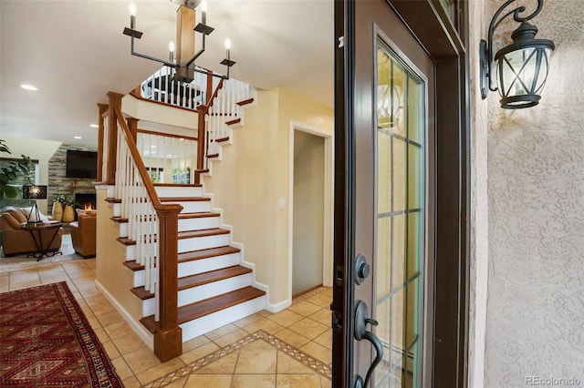 2100 Elk Rdg, Divide, CO 80814 - stairway featuring tile patterned flooring, inlaid floor details, a chandelier, baseboards, and recessed lighting