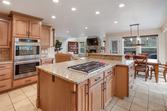2100 Elk Rdg, Divide, CO 80814 - kitchen featuring stainless steel appliances, light tile patterned floors, plenty of natural light, and recessed lighting