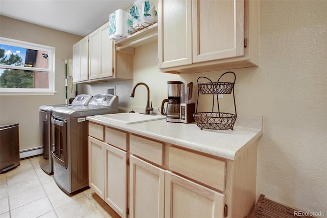 2100 Elk Rdg, Divide, CO 80814 - washroom featuring washing machine and dryer, cabinet space, a baseboard heating unit, and a textured wall