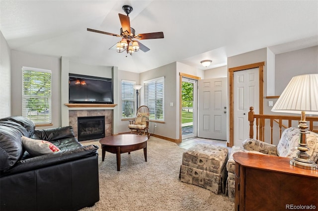 660 Callisto Dr, Loveland, CO 80537 - living area featuring ceiling fan, a fireplace, light carpet, vaulted ceiling, and baseboards