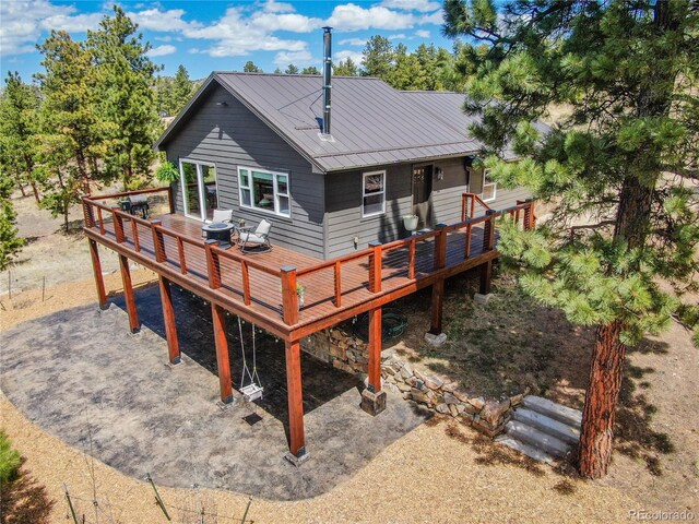 47 Wykagyl Cir, Westcliffe, CO 81252 - rear view of house with a deck and metal roof