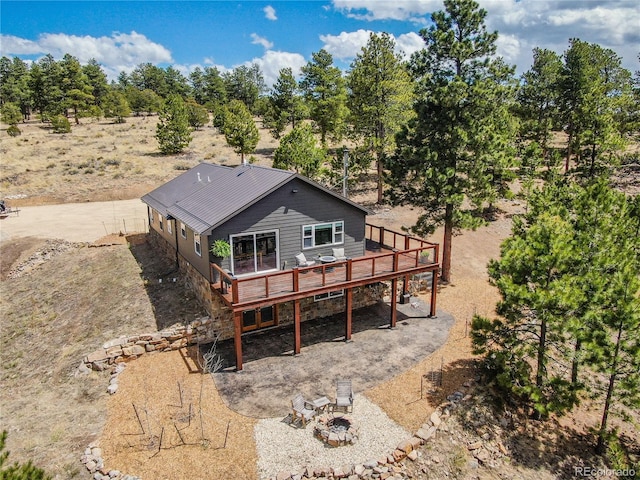 47 Wykagyl Cir, Westcliffe, CO 81252 - rear view of house featuring a fire pit and a deck