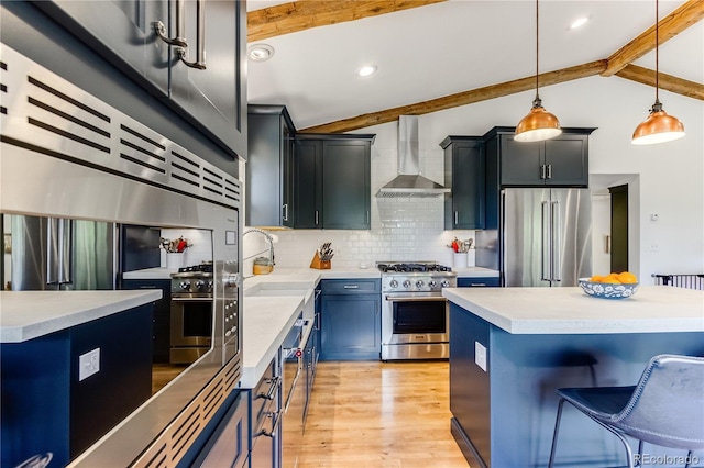 47 Wykagyl Cir, Westcliffe, CO 81252 - kitchen with light countertops, decorative backsplash, wall chimney exhaust hood, and high quality appliances