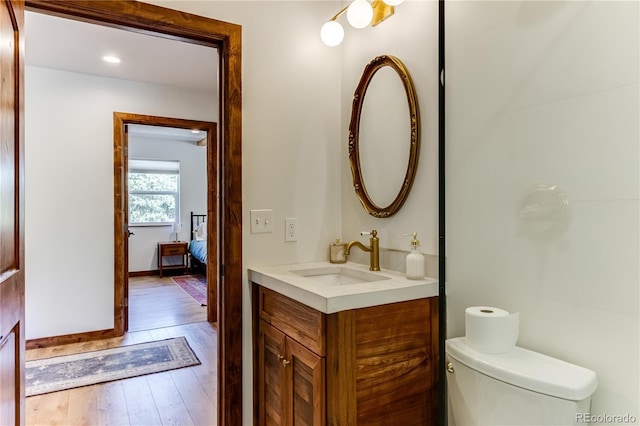 47 Wykagyl Cir, Westcliffe, CO 81252 - bathroom with toilet, baseboards, wood finished floors, and vanity