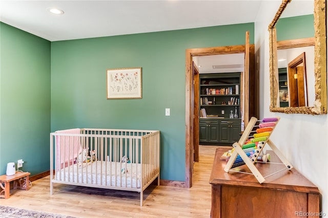47 Wykagyl Cir, Westcliffe, CO 81252 - bedroom with recessed lighting, baseboards, a crib, and wood finished floors