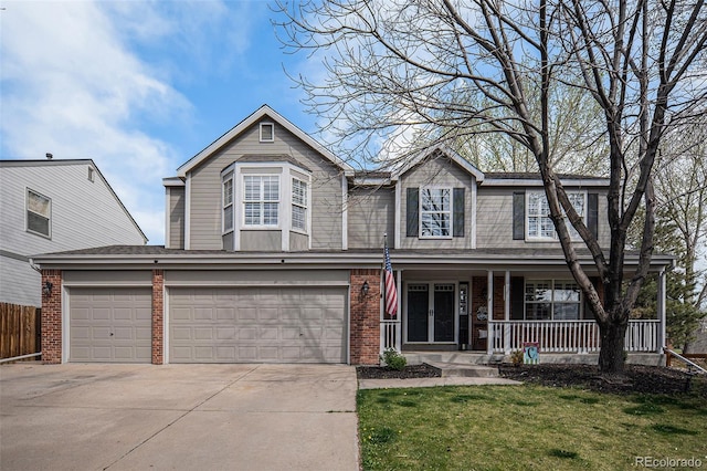 13340 Saint Paul St, Thornton, CO 80241 - view of front of home featuring concrete driveway, brick siding, a porch, a front lawn, and a garage