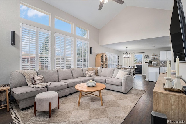 13340 Saint Paul St, Thornton, CO 80241 - living room with a chandelier, a ceiling fan, light wood-style floors, and high vaulted ceiling