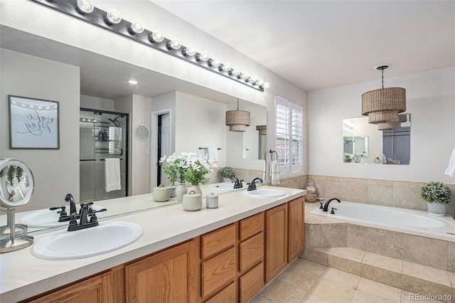 13340 Saint Paul St, Thornton, CO 80241 - full bathroom with a bath, double vanity, a shower stall, and tile patterned floors