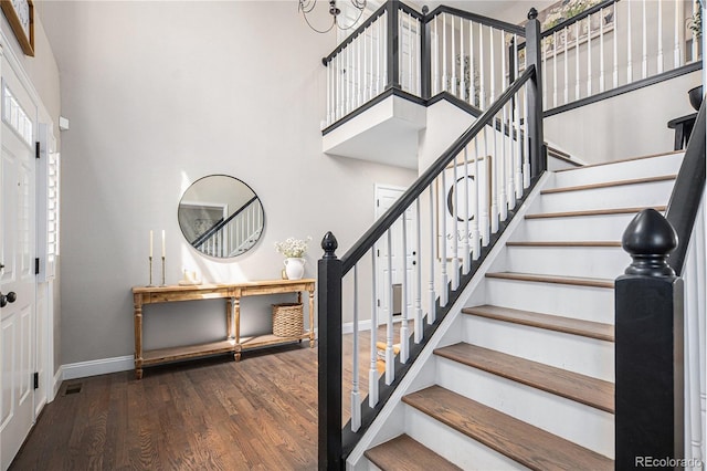 13340 Saint Paul St, Thornton, CO 80241 - entrance foyer with wood finished floors, stairway, and a towering ceiling