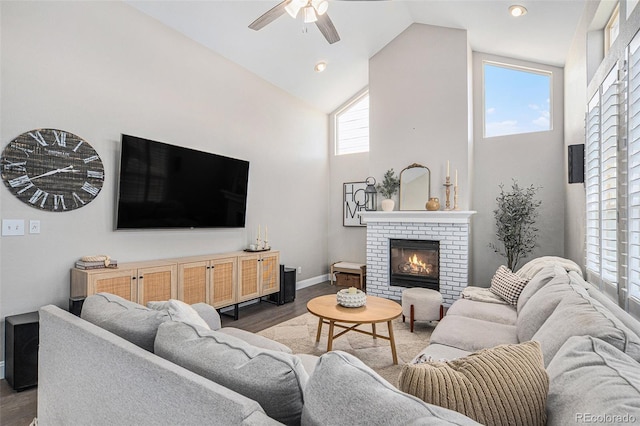 13340 Saint Paul St, Thornton, CO 80241 - living area featuring high vaulted ceiling, a brick fireplace, wood finished floors, and a ceiling fan