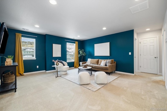 living area featuring baseboards, carpet flooring, visible vents, and recessed lighting