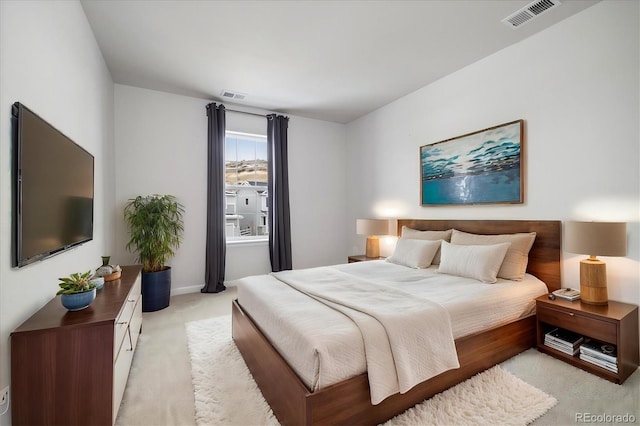 bedroom with light carpet and visible vents