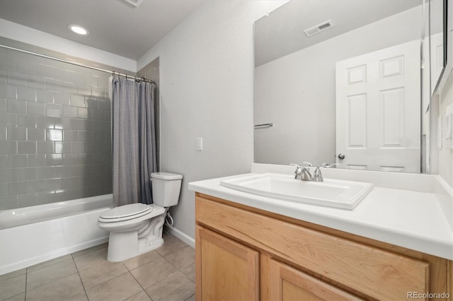 bathroom featuring visible vents, toilet, shower / tub combo, vanity, and tile patterned floors