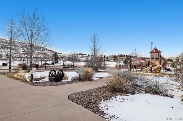 view of home's community featuring playground community