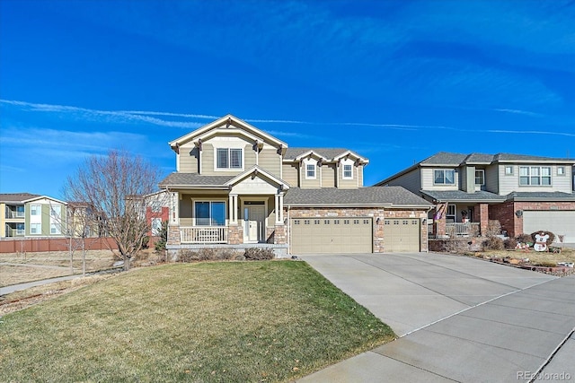 view of front of property with a garage, a porch, and a front yard