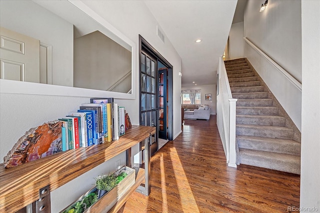 hallway with dark hardwood / wood-style floors