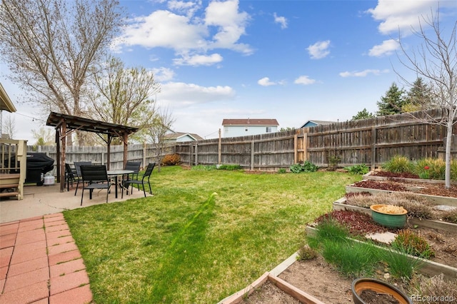 6760 Oakwood Blvd, Colorado Springs, CO 80923 - view of yard featuring a patio and a vegetable garden