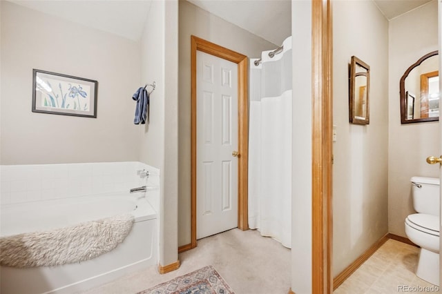 6760 Oakwood Blvd, Colorado Springs, CO 80923 - full bathroom with toilet, a garden tub, and baseboards