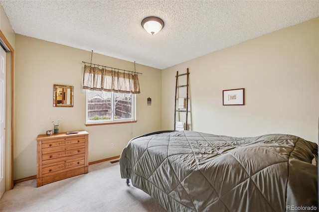 6760 Oakwood Blvd, Colorado Springs, CO 80923 - carpeted bedroom featuring baseboards and a textured ceiling