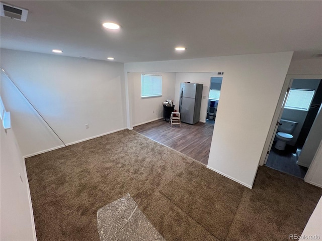 spare room featuring dark wood-type flooring