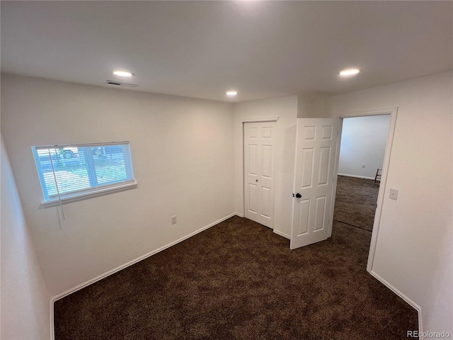 basement with dark carpet