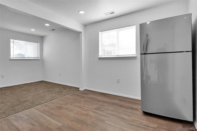 empty room with hardwood / wood-style floors