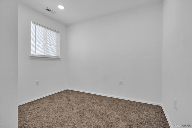 unfurnished room with carpet flooring