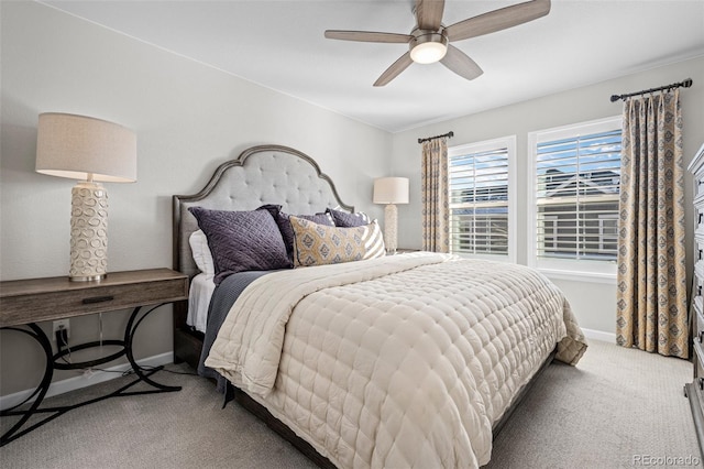 bedroom featuring ceiling fan and light carpet